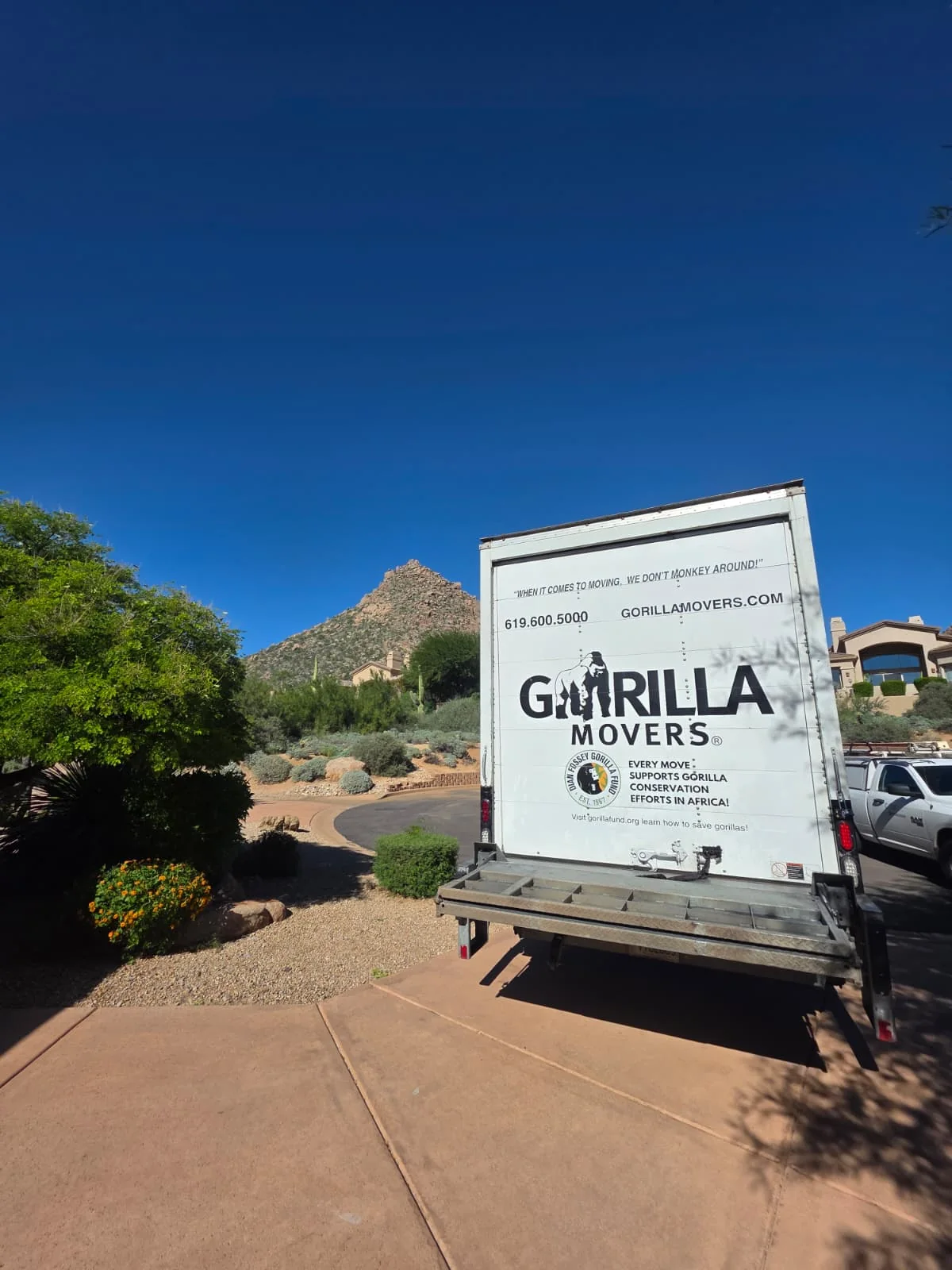 Gorilla Movers truck parked below a desert mountain on a Phoenix, Arizona move