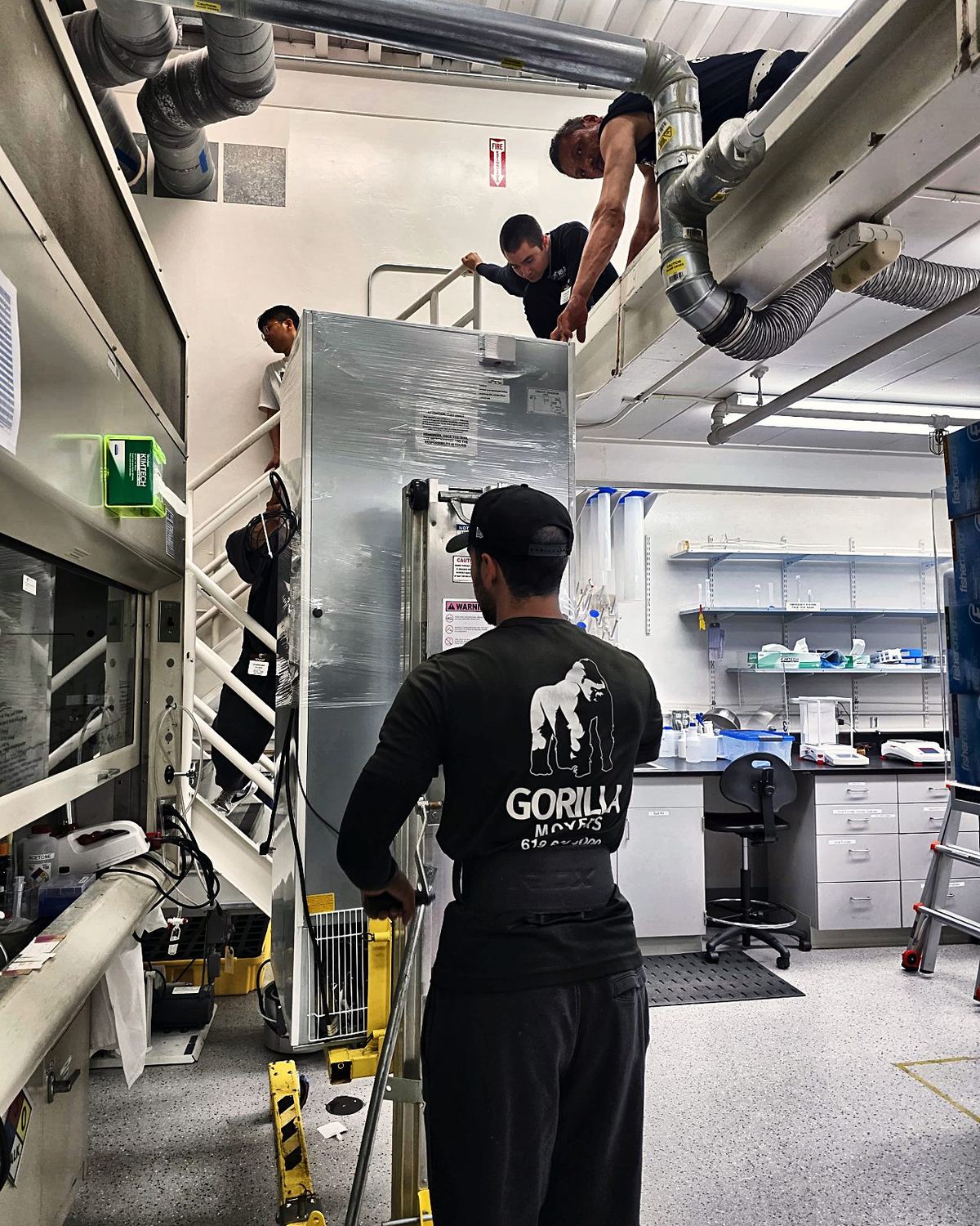 Biosafety cabinet hoisted to a mezzanine on a Sorrento Valley lab job