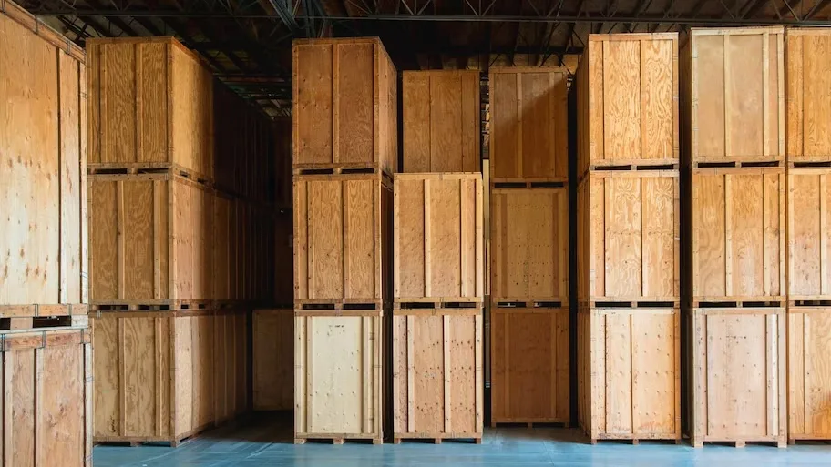 Rows of wooden storage vaults stacked to the ceiling in the Gorilla Movers San Diego warehouse